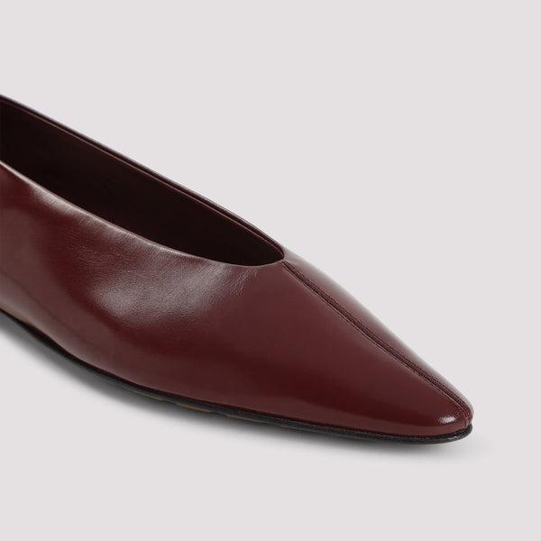 Close-up of Bottega Veneta slides hardware and fine stitching