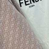 Close-up of Fendi Coat signature hardware and stitching detail