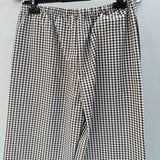Close-up of Celine Trousers signature hardware and stitching detail