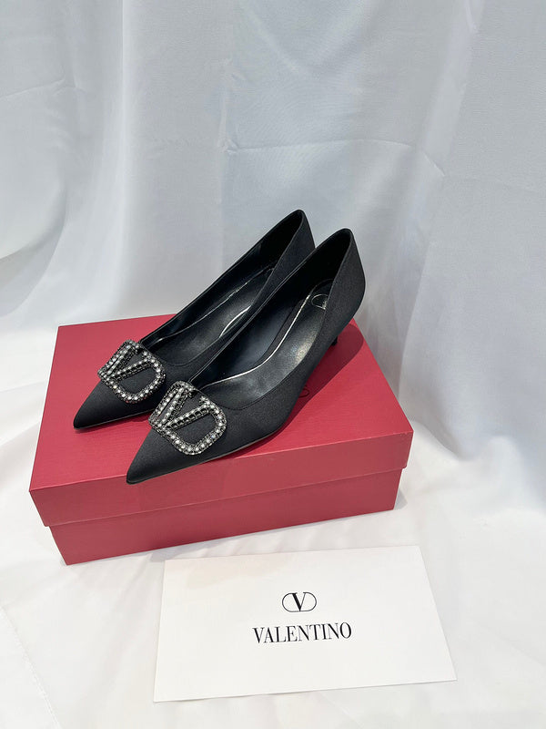 Side profile view of Valentino Garavani luxury piece style No.216