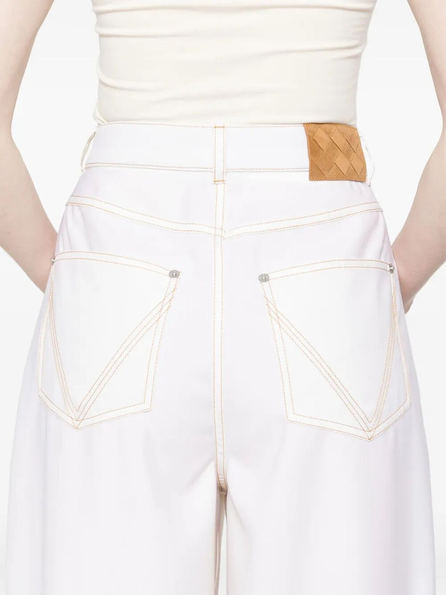 Close-up of Bottega Veneta clothing hardware and fine stitching
