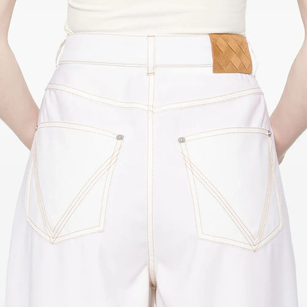 Close-up of Bottega Veneta clothing hardware and fine stitching