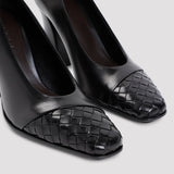Close-up of Bottega Veneta slides hardware and fine stitching