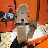 Hermès Grey Crisscross Strap Sandals - Heel Detail View