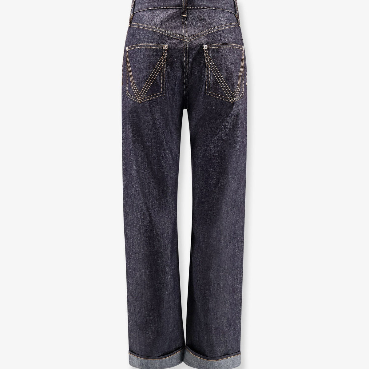 Close-up of Bottega Veneta pants hardware and fine stitching