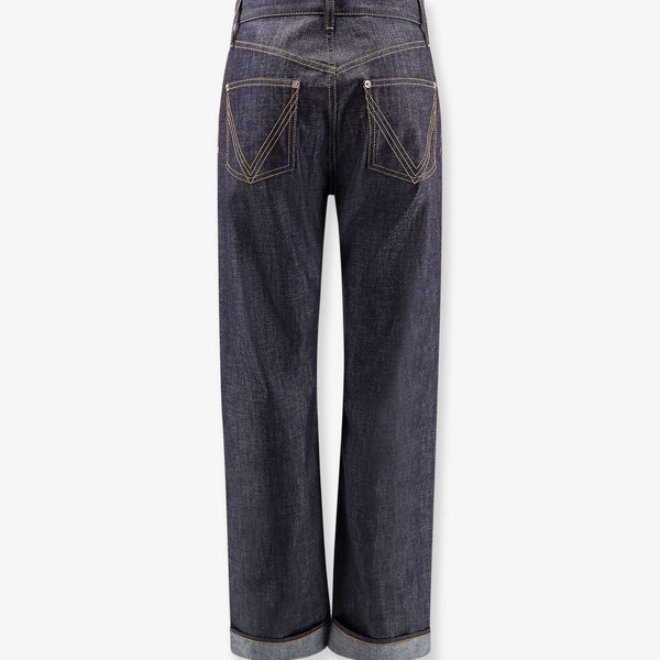 Close-up of Bottega Veneta pants hardware and fine stitching