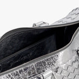 Close-up of Bottega Veneta travel and lugguage hardware and fine stitching