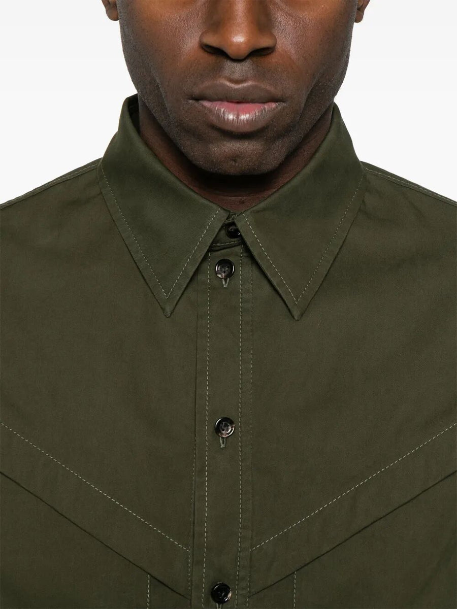Close-up of Bottega Veneta blouses hardware and fine stitching
