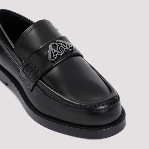 Close-up of Alexander McQueen slides hardware and fine stitching
