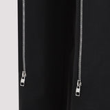 Close-up of Alexander McQueen pants hardware and fine stitching