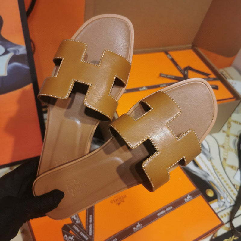 Hermès Red Crisscross Strap Sandals - Angled View