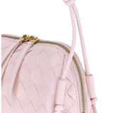 Close-up of Bottega Veneta clutches hardware and fine stitching