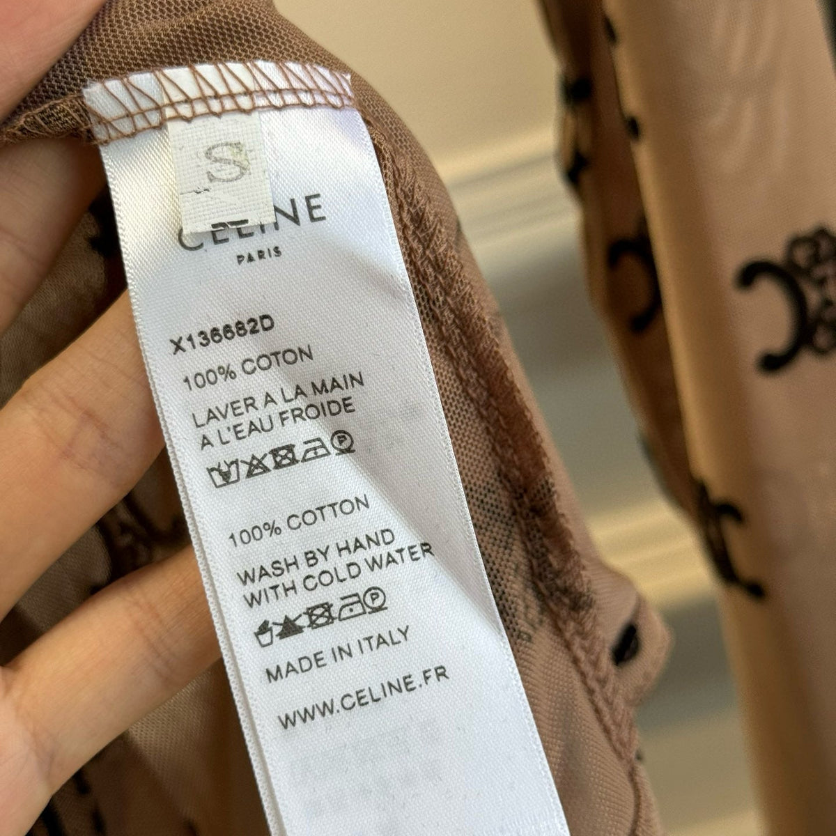 Close-up of Celine Bodysuit signature hardware and stitching detail