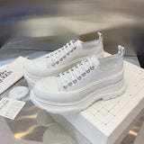 Alexander McQueen Nude Chunky Platform Sneakers - Close-Up Texture View
