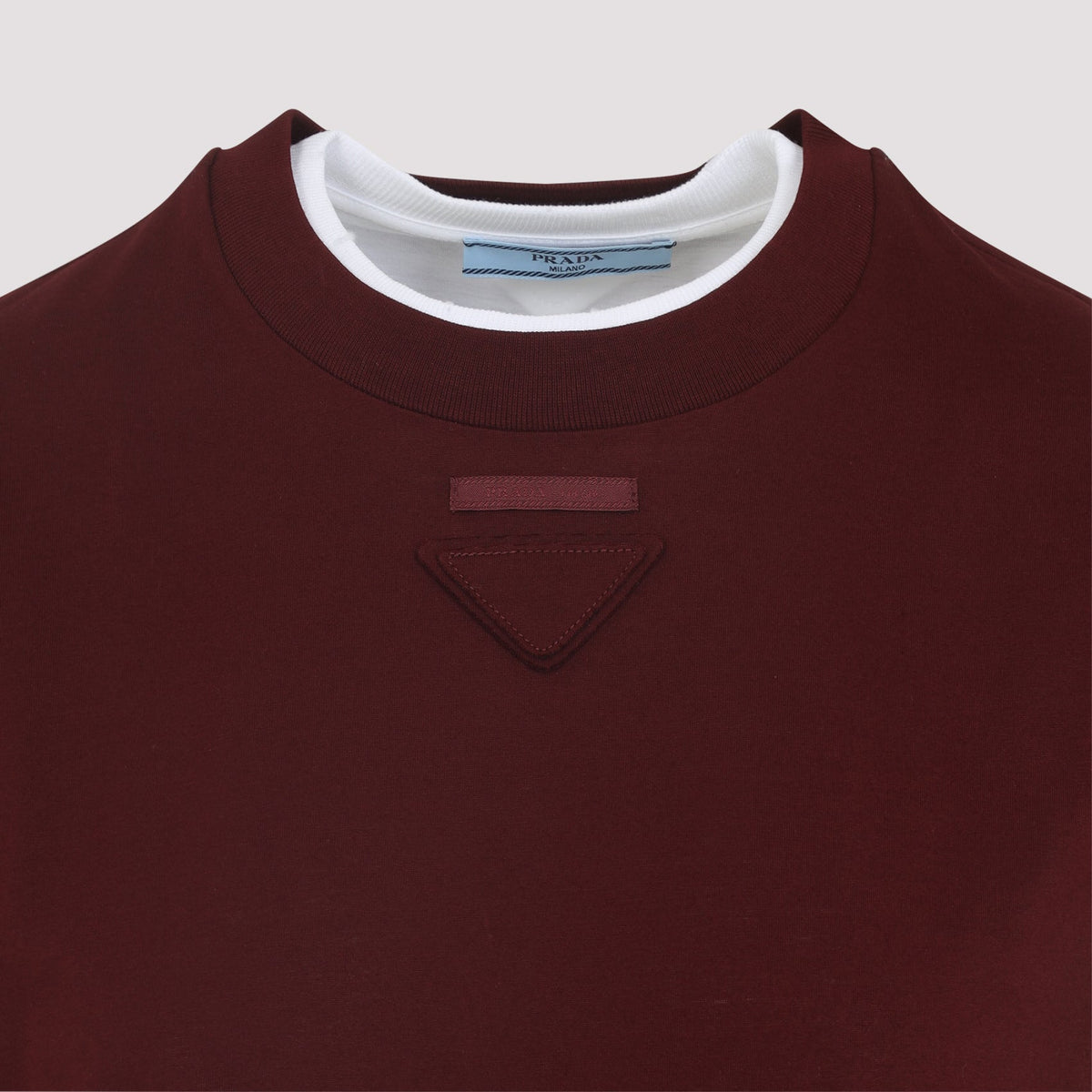 Close-up of Prada t-shirts & tops hardware and fine stitching
