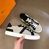 Hermès White Low-Top Sneakers - Angled View