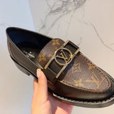 Close-up detail view of Louis Vuitton luxury piece style No.049