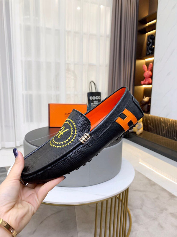 Hermès Chocolate Brown Loafer Flats - Close-Up Texture View