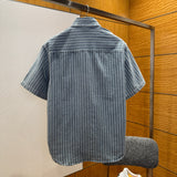 Christian Dior Denim Shirt – luxury designer piece at Velouxe