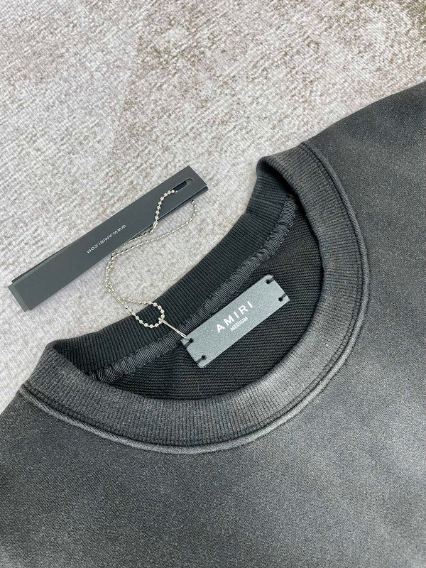 Close-up detail view of Amiri luxury piece style No.061