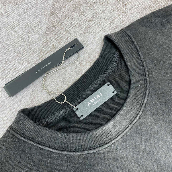Close-up detail view of Amiri luxury piece style No.061