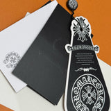Chrome Hearts Jeans flat lay on neutral background