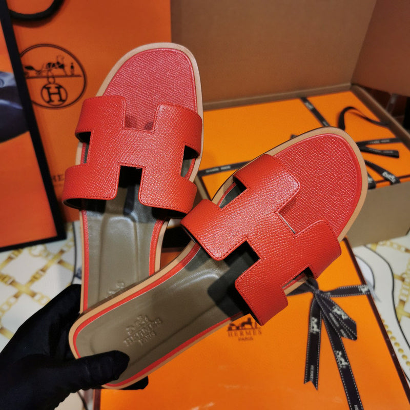 Hermes sandals Style 087 - close-up of statement logo accent