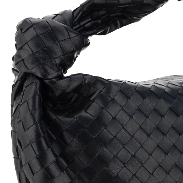 Close-up of Bottega Veneta shoulder bags hardware and fine stitching