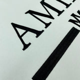 Three-quarter angle view of Amiri luxury piece style No.075