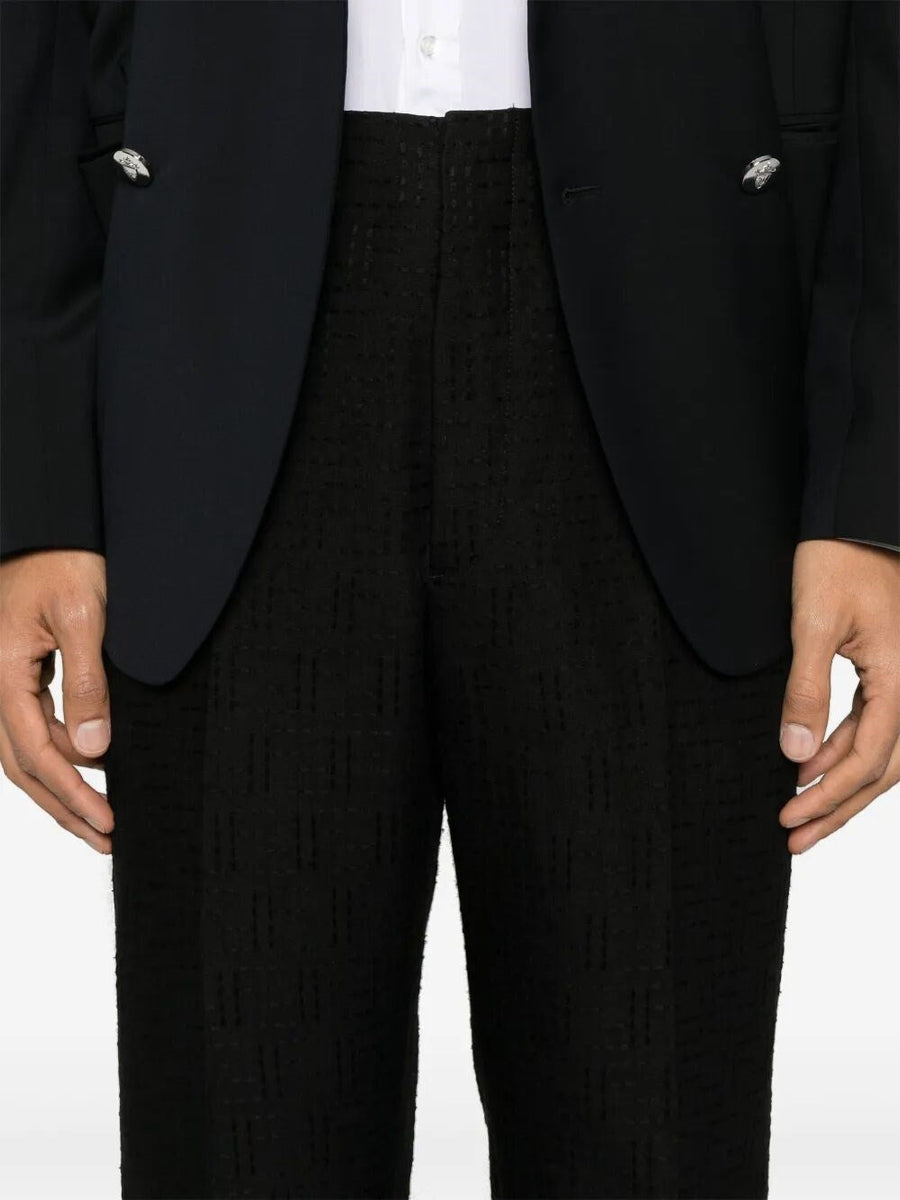 Close-up of Fendi pants hardware and fine stitching