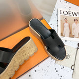 Hermès Tan Flat Thong Sandals - Close-Up Texture View