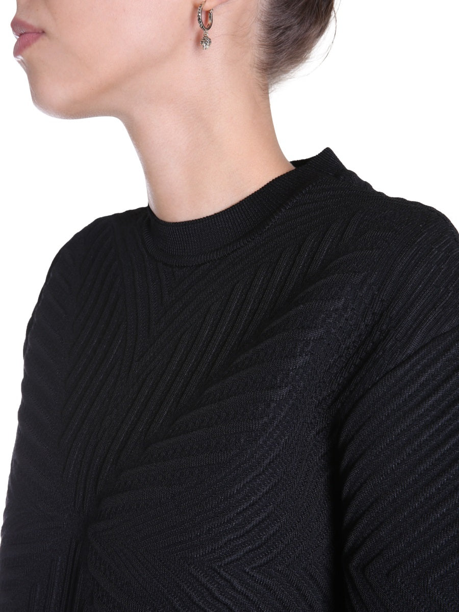Close-up of Alexander McQueen sweaters & pullovers hardware and fine stitching