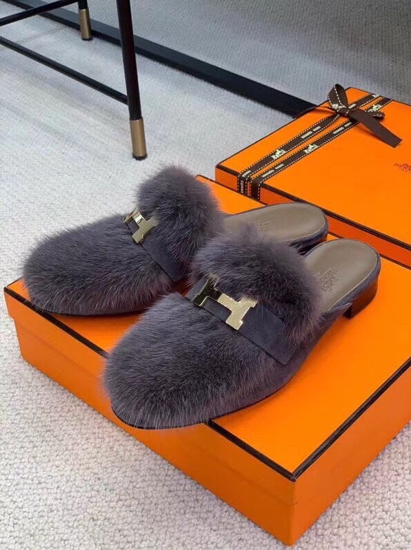 Hermès White Chelsea Boots - Angled View