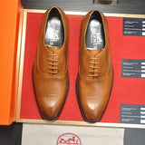 Hermès Black Slip-On Sneakers - Angled View
