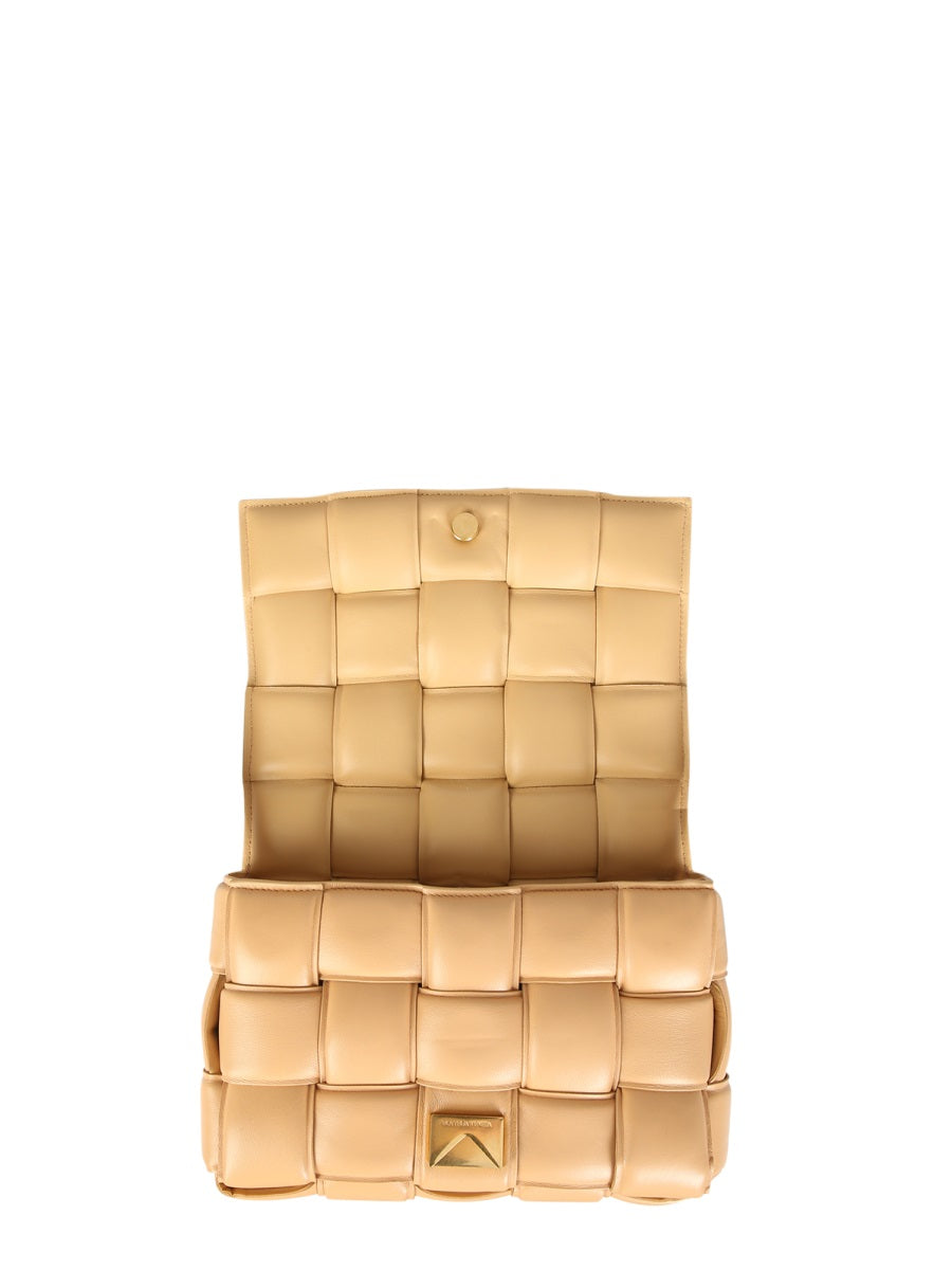Close-up of Bottega Veneta cross body bags hardware and fine stitching