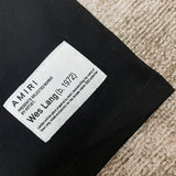 Front view of Amiri luxury piece style No.119