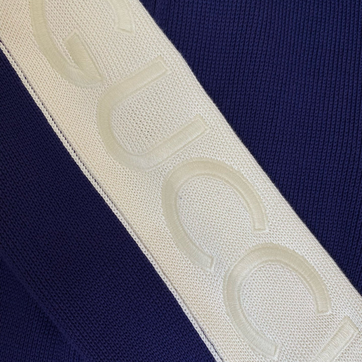 Close-up of Gucci Bomber Jacket signature hardware and stitching detail