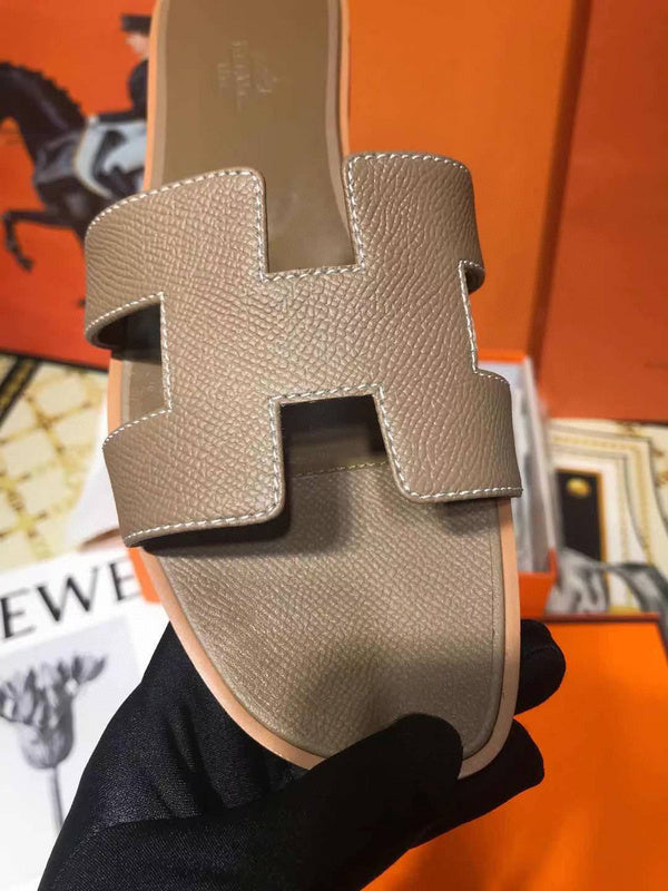 Hermès Grey Crisscross Strap Sandals - Close-Up Texture View