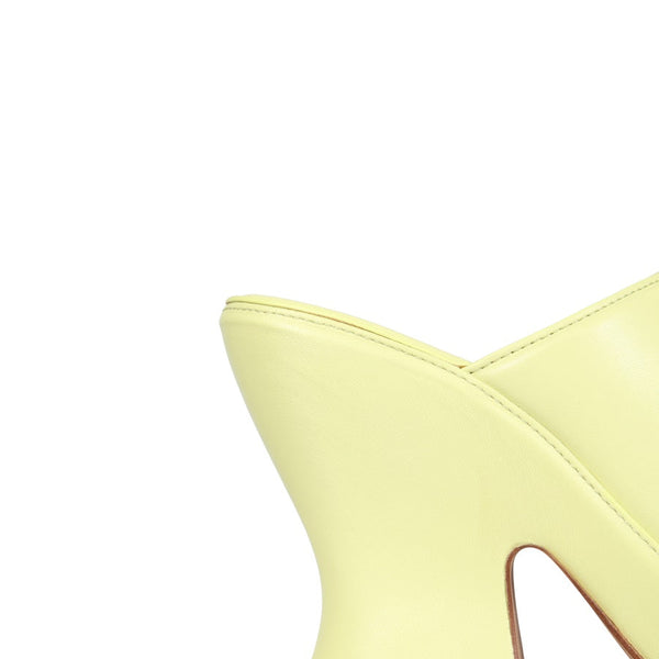 Close-up of Bottega Veneta sandals hardware and fine stitching