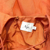 Aje Dress detail shot – authentic designer craftsmanship
