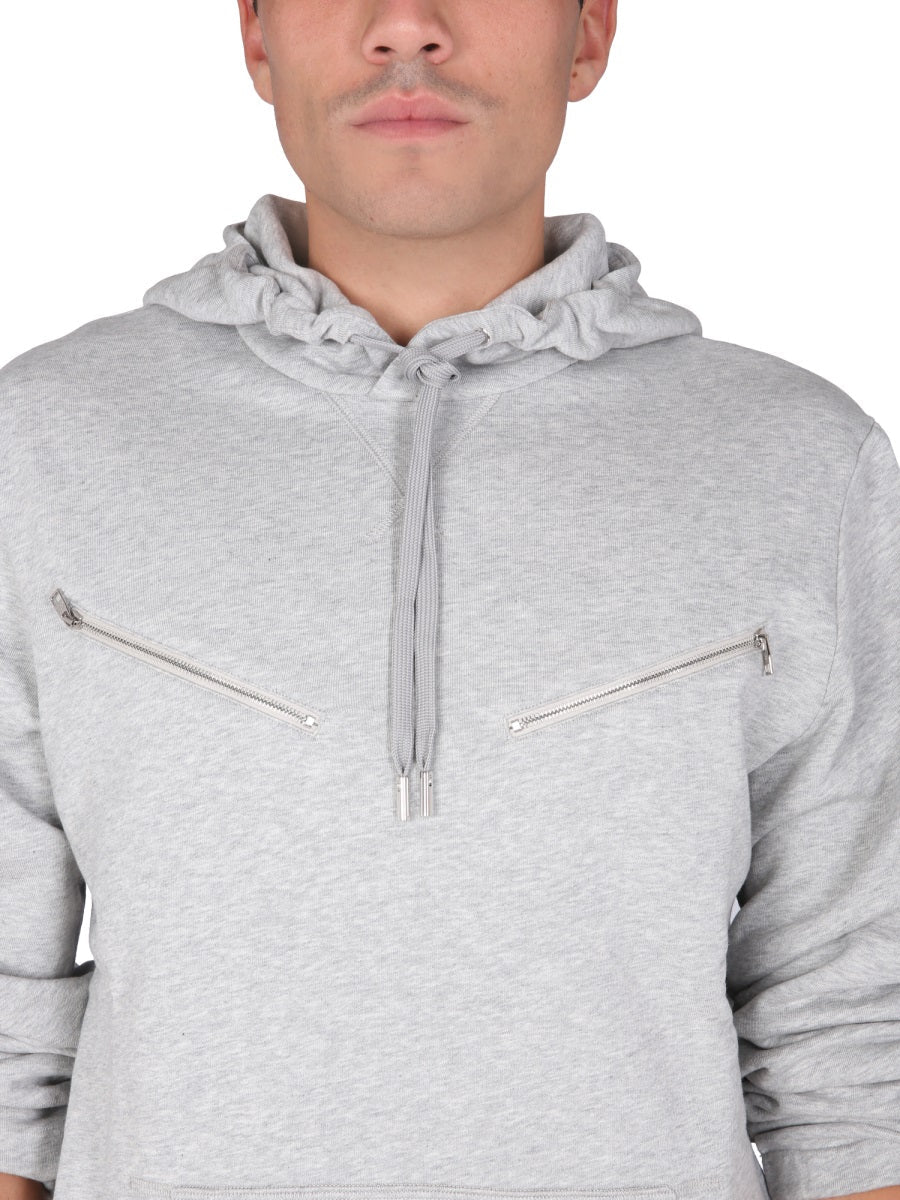 Close-up of Alexander McQueen sweaters & pullovers hardware and fine stitching