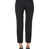 Close-up of Alexander McQueen pants hardware and fine stitching