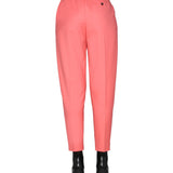Close-up of Alexander McQueen pants hardware and fine stitching