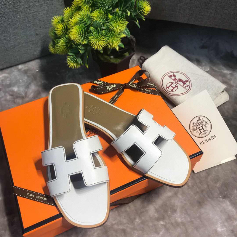 Hermes sandals Style 075 - close-up of classic monogram styling