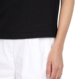 Close-up of Alexander McQueen tee shirts hardware and fine stitching