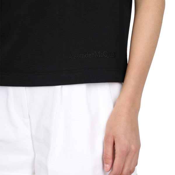 Close-up of Alexander McQueen tee shirts hardware and fine stitching