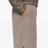 Close-up of Fendi pants hardware and fine stitching