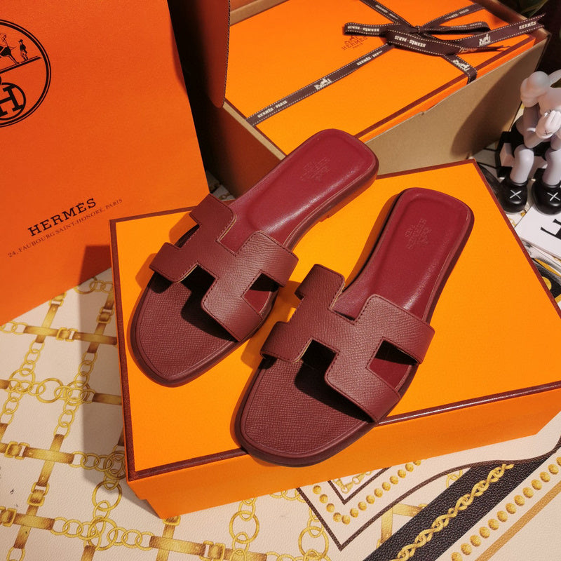 Hermès Grey Slide Sandals - Angled View