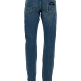 Close-up of Alexander McQueen pants hardware and fine stitching