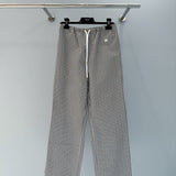 Front view of Celine premium Trousers with iconic logo hardware